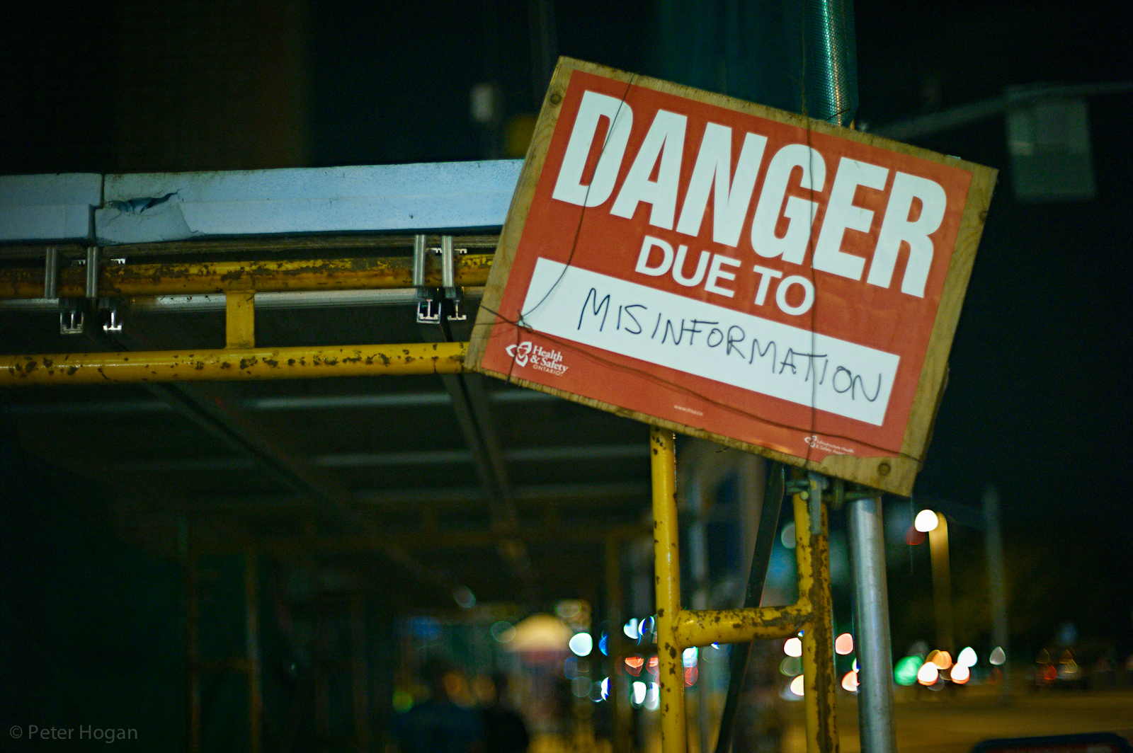 Misinformation by 3dpete is a photo of a construction site with a wood-backed danger sign in red stating 'Danger due to Misinformation'